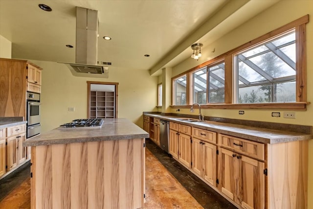 kitchen featuring light brown cabinets, a kitchen island, sink, and stainless steel appliances