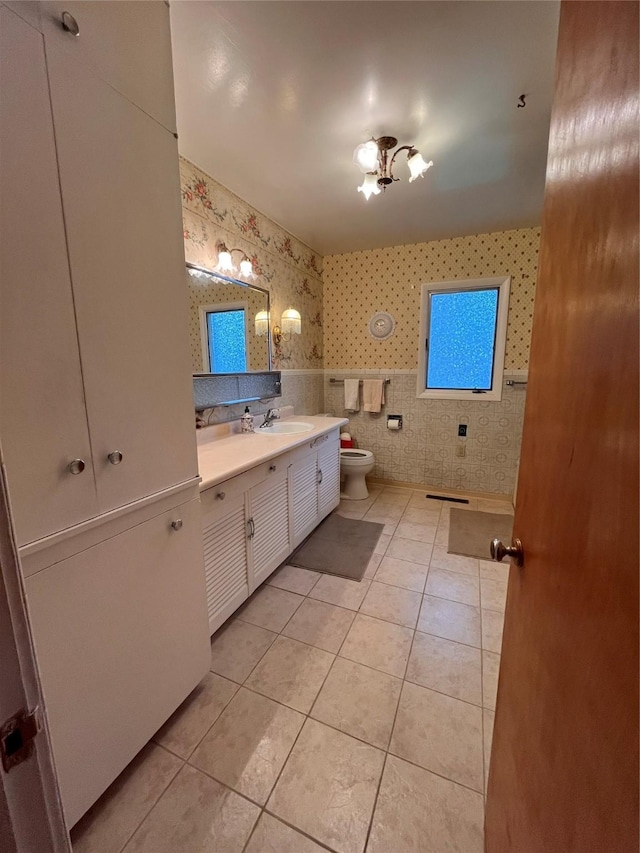 233 4th Ave SW, Cut Bank, MT 59427 - full bathroom with wallpapered walls, tile patterned flooring, and vanity