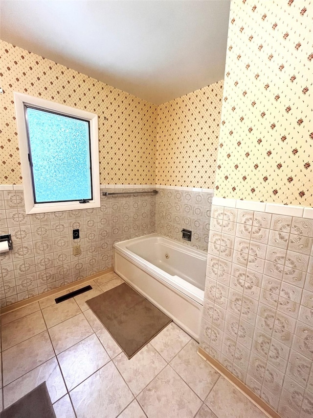 233 4th Ave SW, Cut Bank, MT 59427 - bathroom featuring wallpapered walls, a bath, wainscoting, tile walls, and tile patterned floors