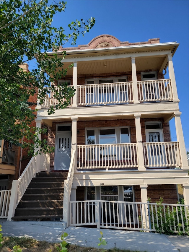 view of front facade with a balcony