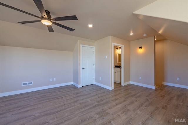 bonus room featuring ceiling fan, lofted ceiling, and light hardwood / wood-style flooring