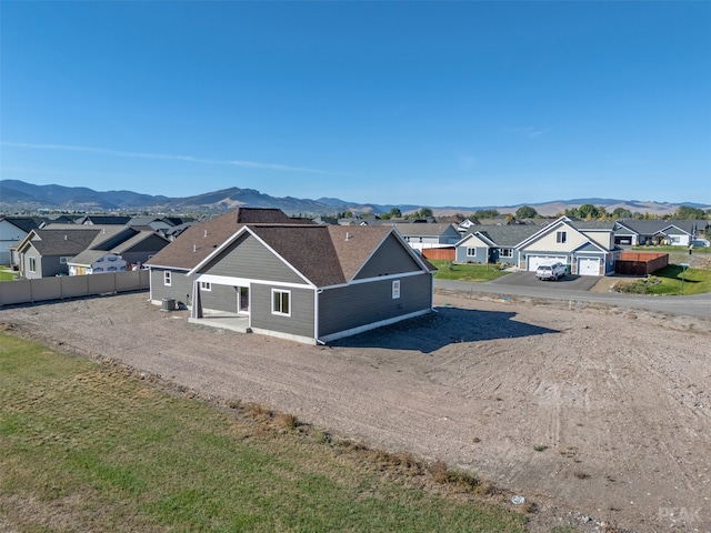 birds eye view of property featuring a mountain view