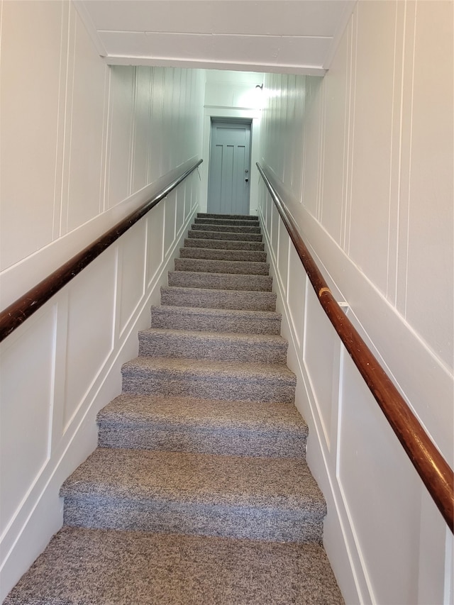 stairway with carpet flooring