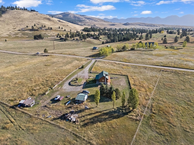 birds eye view of property with a mountain view and a rural view