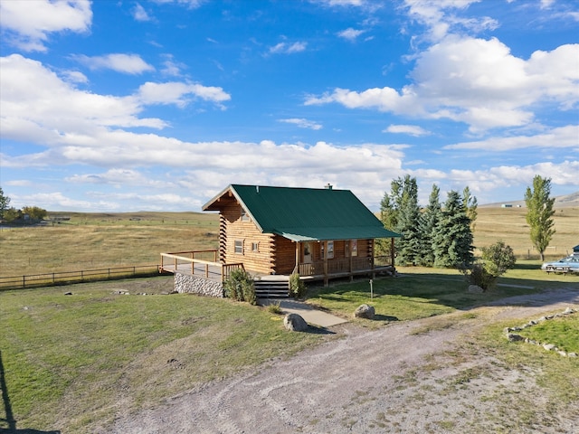 view of side of home with a rural view