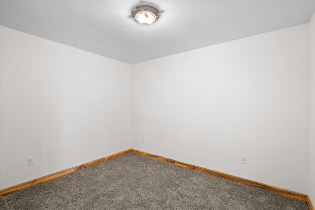 empty room featuring carpet flooring