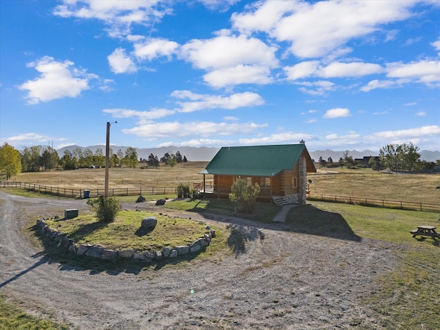 view of yard featuring a mountain view and a rural view