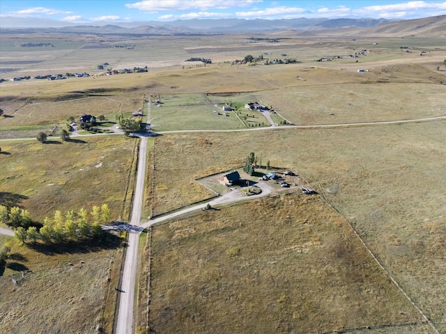 bird's eye view featuring a mountain view and a rural view