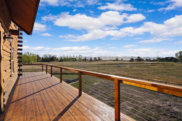 wooden deck featuring a rural view