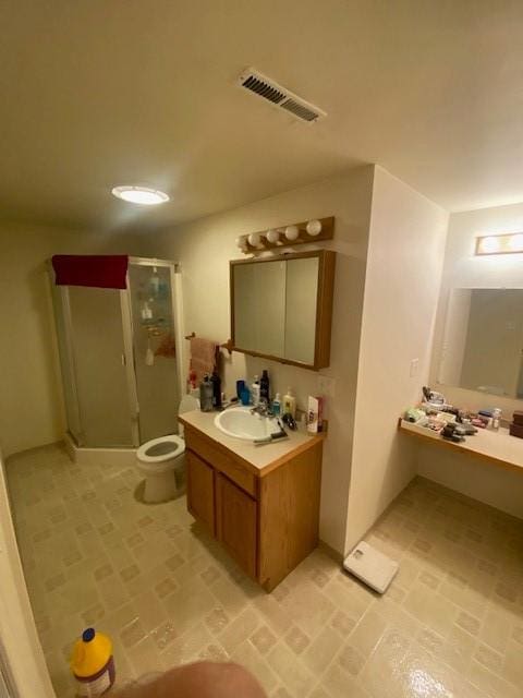 2417 S 3rd St W, Missoula, MT 59801 - bathroom featuring brick patterned floors, a shower stall, toilet, and vanity