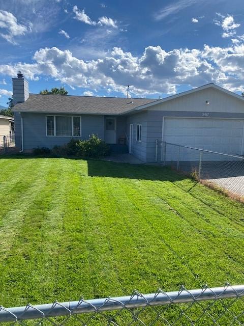 2417 S 3rd St W, Missoula, MT 59801 - single story home with a garage, driveway, and a chimney