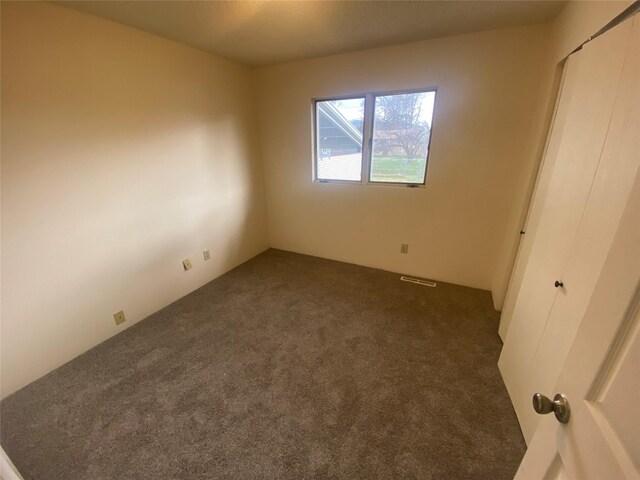 2417 S 3rd St W, Missoula, MT 59801 - unfurnished bedroom featuring dark carpet