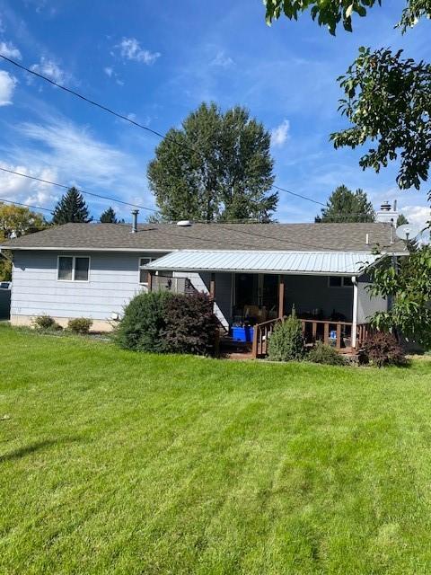 2417 S 3rd St W, Missoula, MT 59801 - rear view of house featuring a yard and covered porch