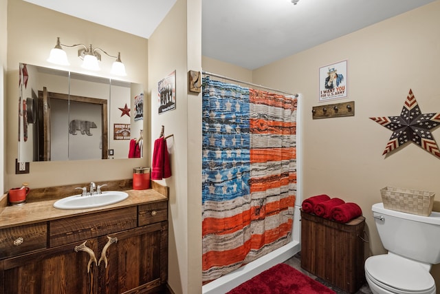 bathroom featuring vanity, toilet, and a shower with curtain