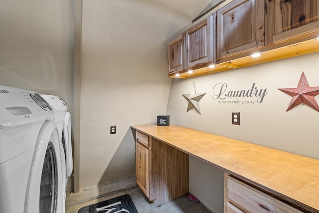 laundry area featuring washer and dryer and cabinets