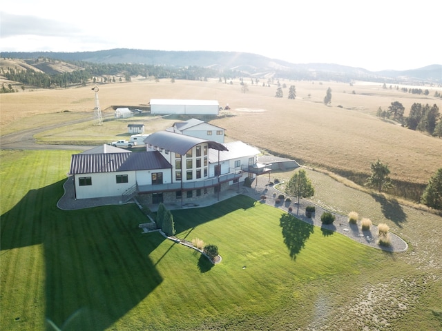 bird's eye view featuring a mountain view and a rural view