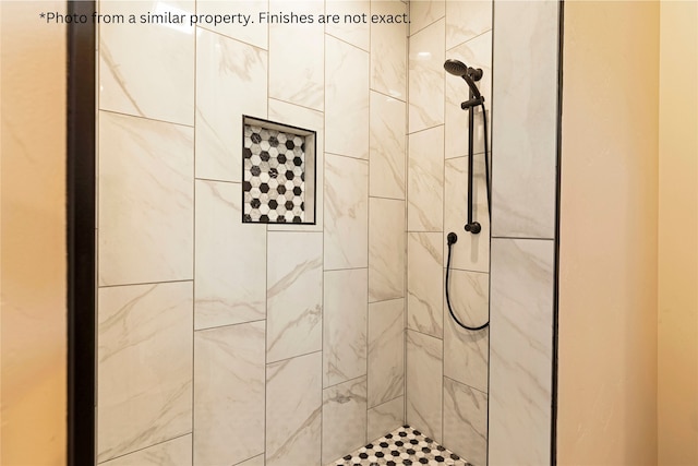 bathroom featuring tiled shower