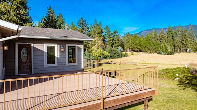 760 Trap Rd, Columbia Falls, MT 59912 - deck with a mountain view and a yard