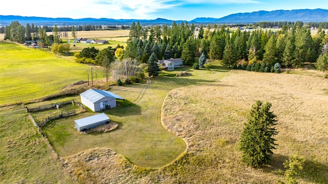 bird's eye view featuring a mountain view and a rural view