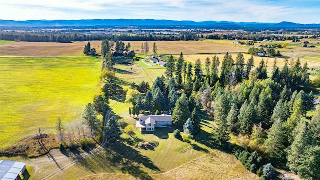760 Trap Rd, Columbia Falls, MT 59912 - aerial view of sparsely populated area with a mountain backdrop