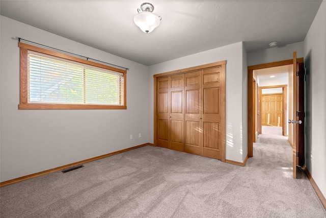 760 Trap Rd, Columbia Falls, MT 59912 - unfurnished bedroom featuring light colored carpet and a closet