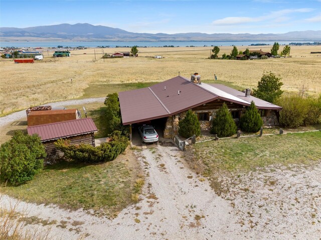 drone / aerial view featuring a rural view and a mountain view
