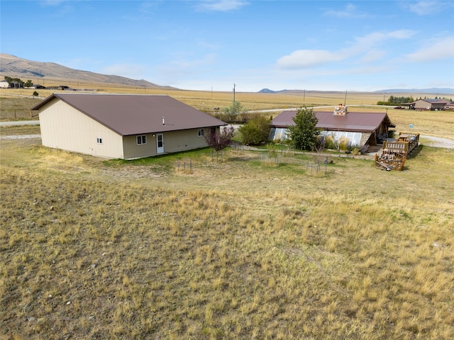 view of yard featuring a mountain view and a rural view