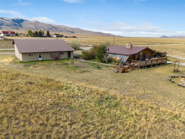 birds eye view of property featuring a mountain view and a rural view