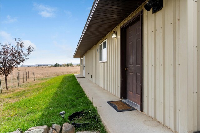 exterior space with a rural view and a mountain view