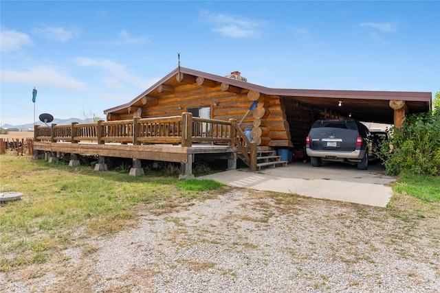 view of front of home featuring a carport