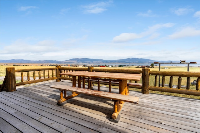 wooden deck featuring a mountain view and a rural view