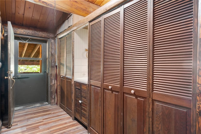 interior space with hardwood / wood-style flooring and wooden ceiling