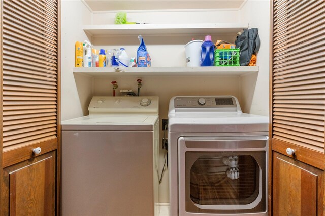 laundry area featuring washing machine and dryer and laundry area