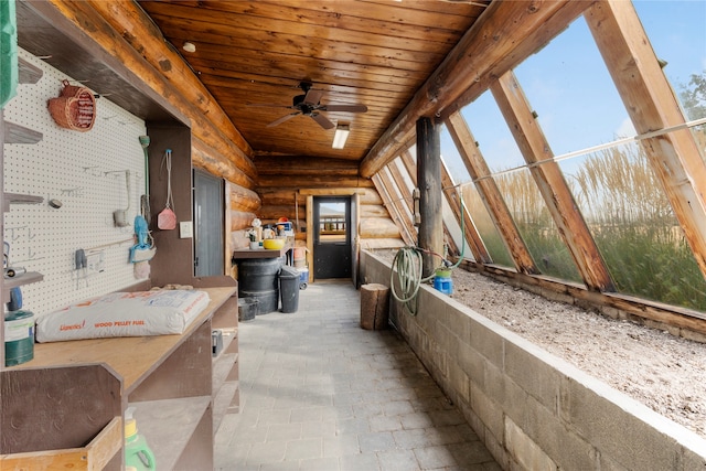 interior space with ceiling fan