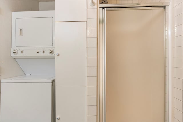 laundry area with stacked washer / dryer