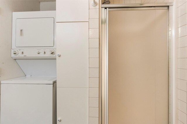 laundry area with stacked washer / drying machine