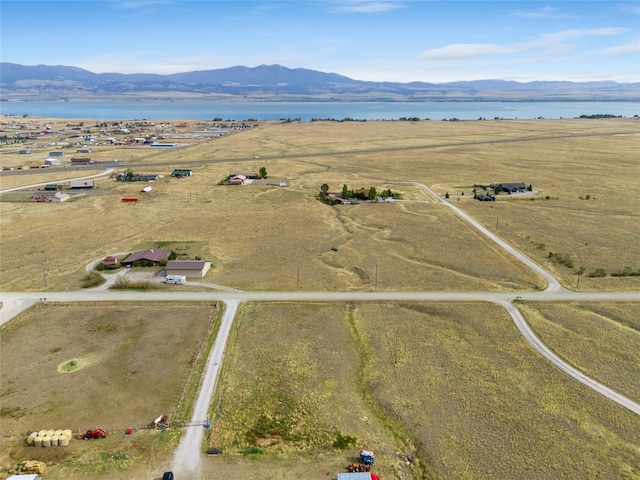 bird's eye view featuring a water and mountain view and a rural view