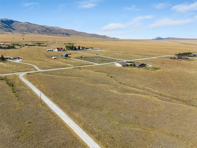 drone / aerial view featuring a mountain view and a rural view