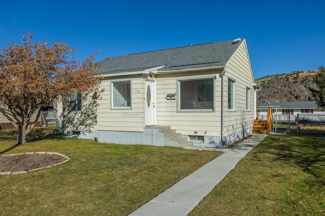 1710 Tammany St, Anaconda, MT 59711 - bungalow-style home with a shingled roof, a front lawn, fence, and a mountain view