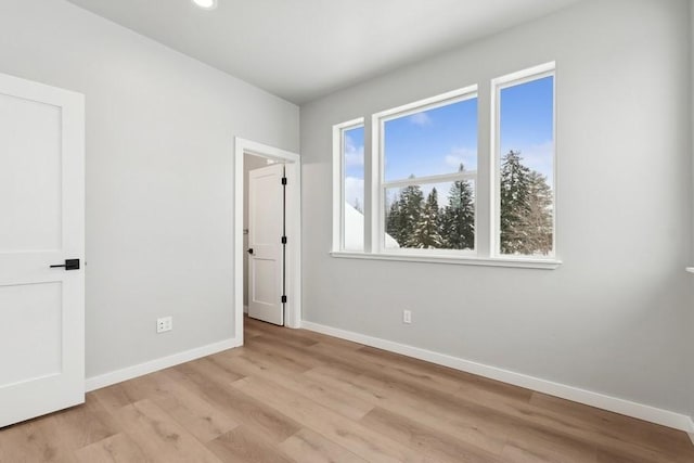 304 Trailview Way, Whitefish, MT 59937 - unfurnished bedroom with light wood-style floors and recessed lighting
