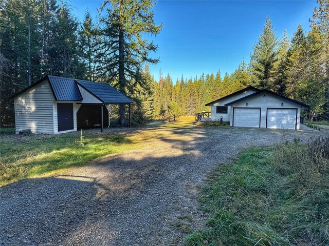 back of property featuring a wooden deck and a yard