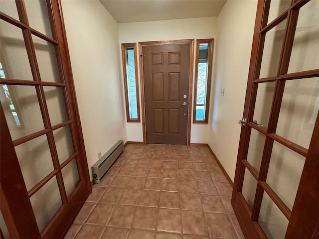 entryway with baseboard heating, baseboards, and french doors