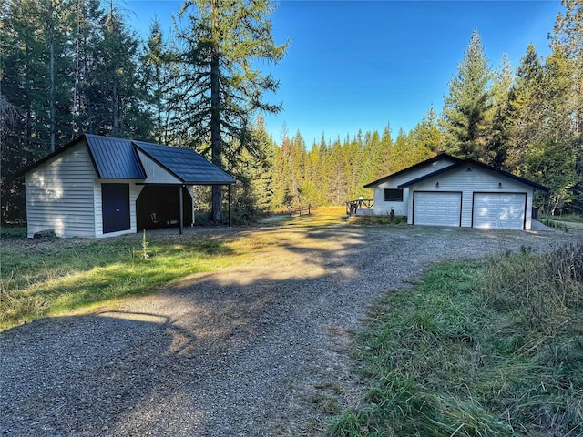 exterior space featuring a wooded view