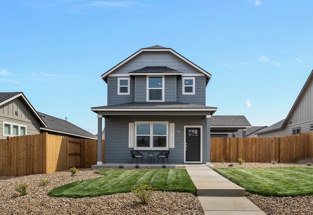 view of front of property featuring a patio and a front lawn