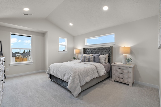 5803 Horn Rd, Missoula, MT 59808 - bedroom featuring light carpet, visible vents, baseboards, and lofted ceiling