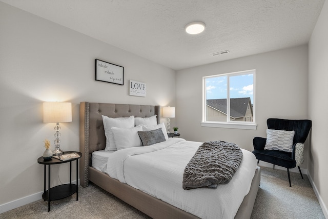 5803 Horn Rd, Missoula, MT 59808 - bedroom featuring a textured ceiling, carpet flooring, baseboards, and visible vents
