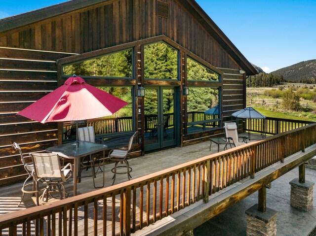 wooden deck featuring a mountain view