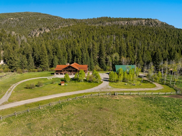 drone / aerial view featuring a mountain view and a rural view