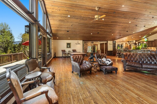 living room with high vaulted ceiling, wood-type flooring, ceiling fan, and wooden ceiling