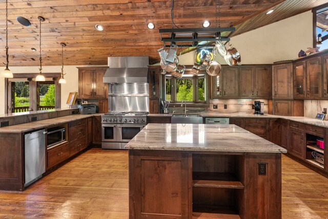 kitchen featuring light hardwood / wood-style flooring, stainless steel appliances, plenty of natural light, and wooden ceiling